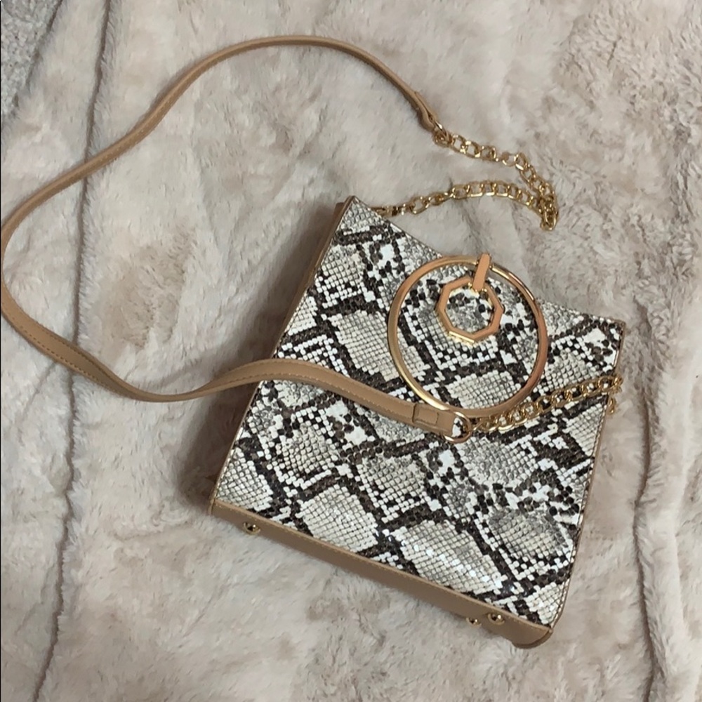 Beige and snake pattern ring handle purse